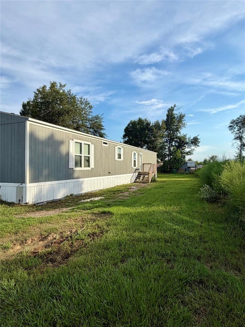 Photo of 1221 Road 5500, Cleveland, TX 77327 (MLS # 53212704)