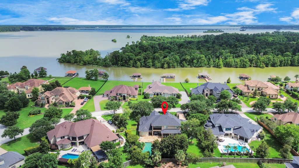 Photo of 6302 S Royal Point Drive, Kingwood, TX 77345 (MLS # 65968485)