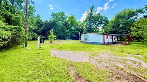 Photo of 833 Beach Airport Road, Conroe, TX 77301 (MLS # 95441691)