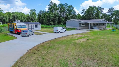 Photo of 12227 County Road 37497, Cleveland, TX 77327 (MLS # 47931313)