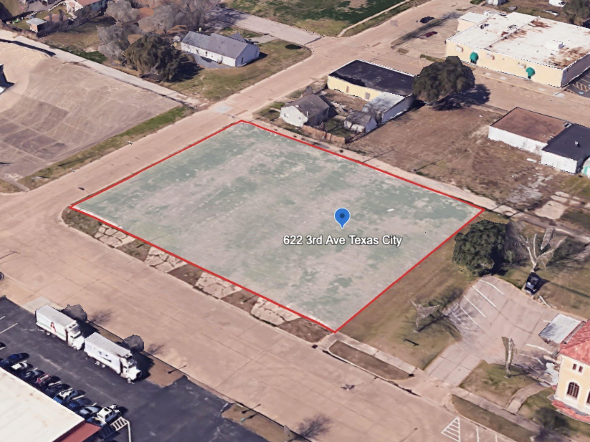 Corner aerial view highlighting the full vacant lot with clear boundary lines and nearby street access