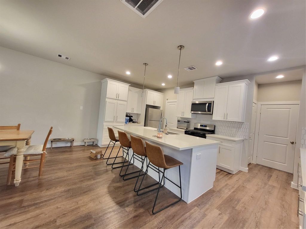 Photo of 6615 Ezzard Charles Lane, Houston, TX 77091 (MLS # 71940645)