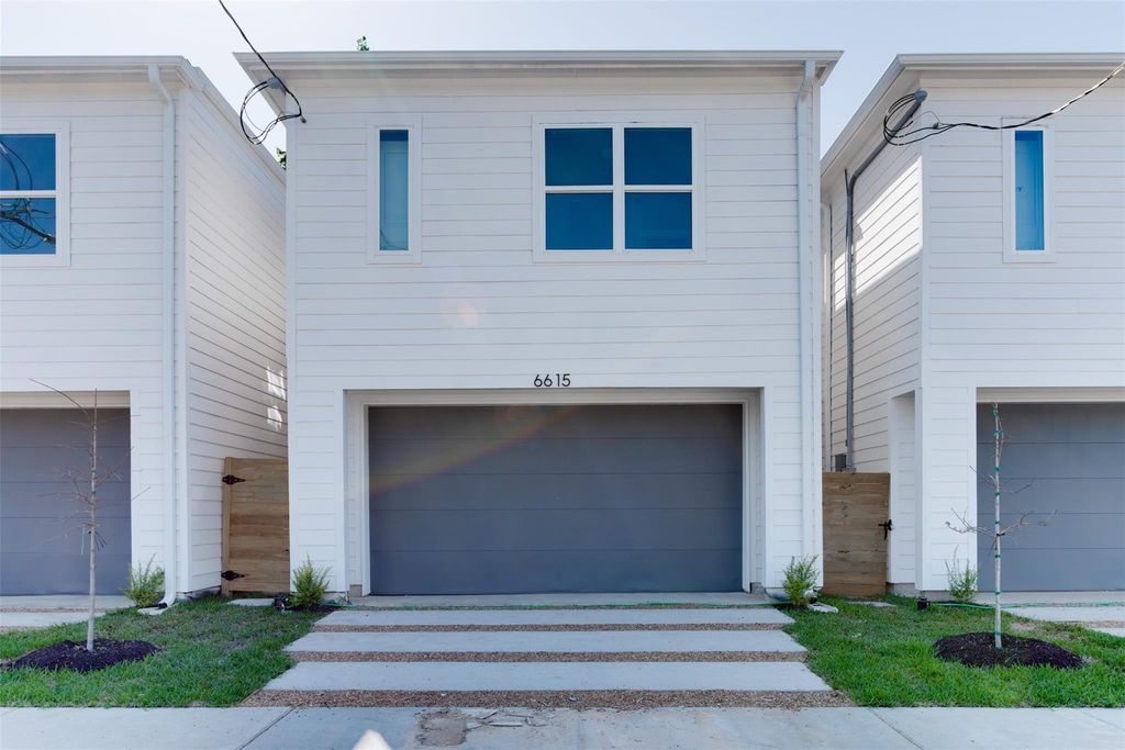 Photo of 6615 Ezzard Charles Lane, Houston, TX 77091 (MLS # 71940645)