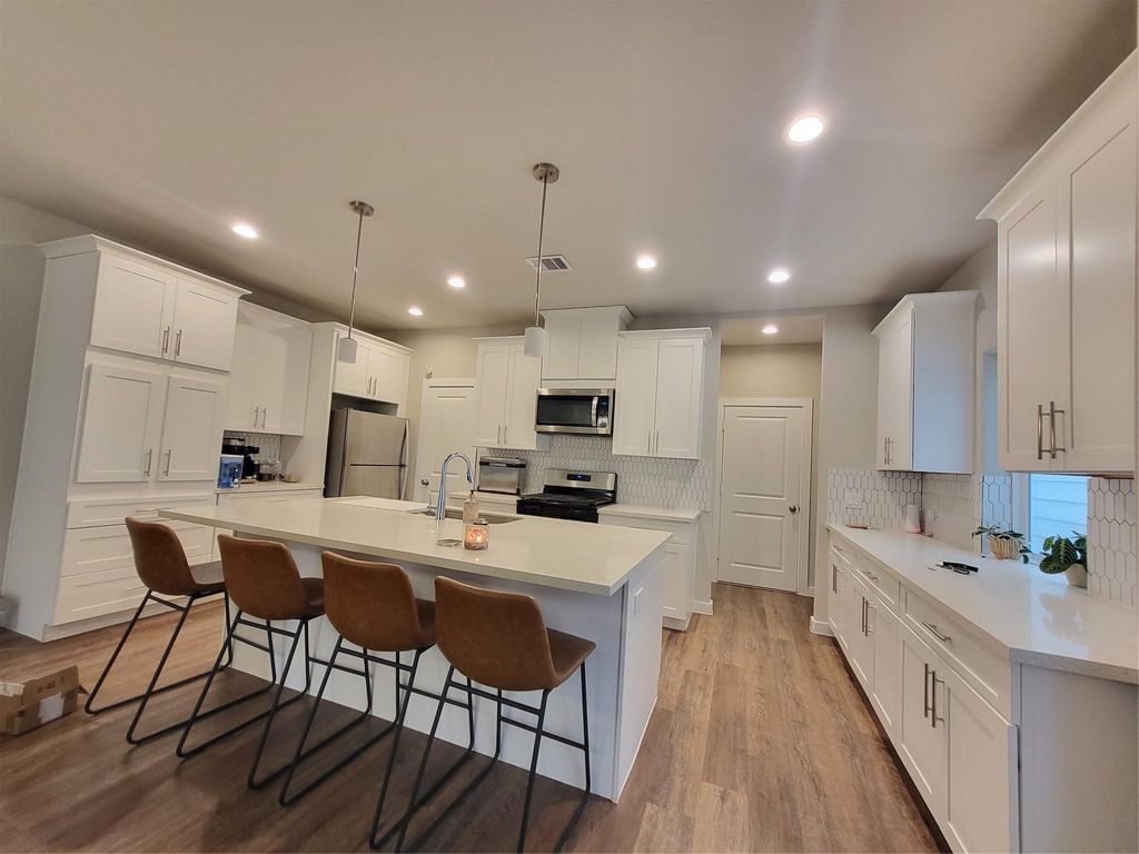 Photo of 6615 Ezzard Charles Lane, Houston, TX 77091 (MLS # 71940645)