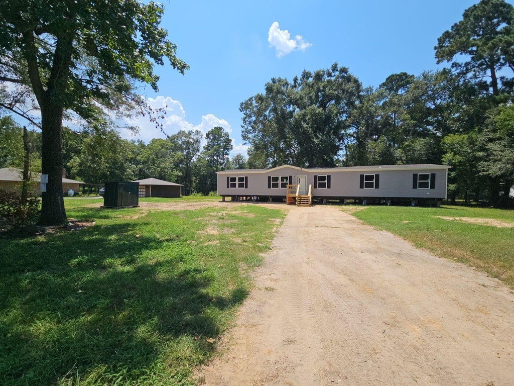 Photo of 20006 Red Oaks South, New Caney, TX 77357 (MLS # 20767425)
