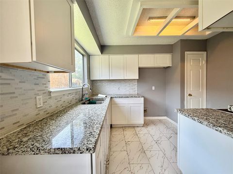 Photo of 8715 Belle Glen Drive, Houston, TX 77099 (MLS # 41869119)