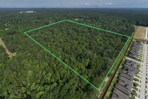 Photo of TBD White Oak Dr, Conroe, TX 77306 (MLS # 75576254)