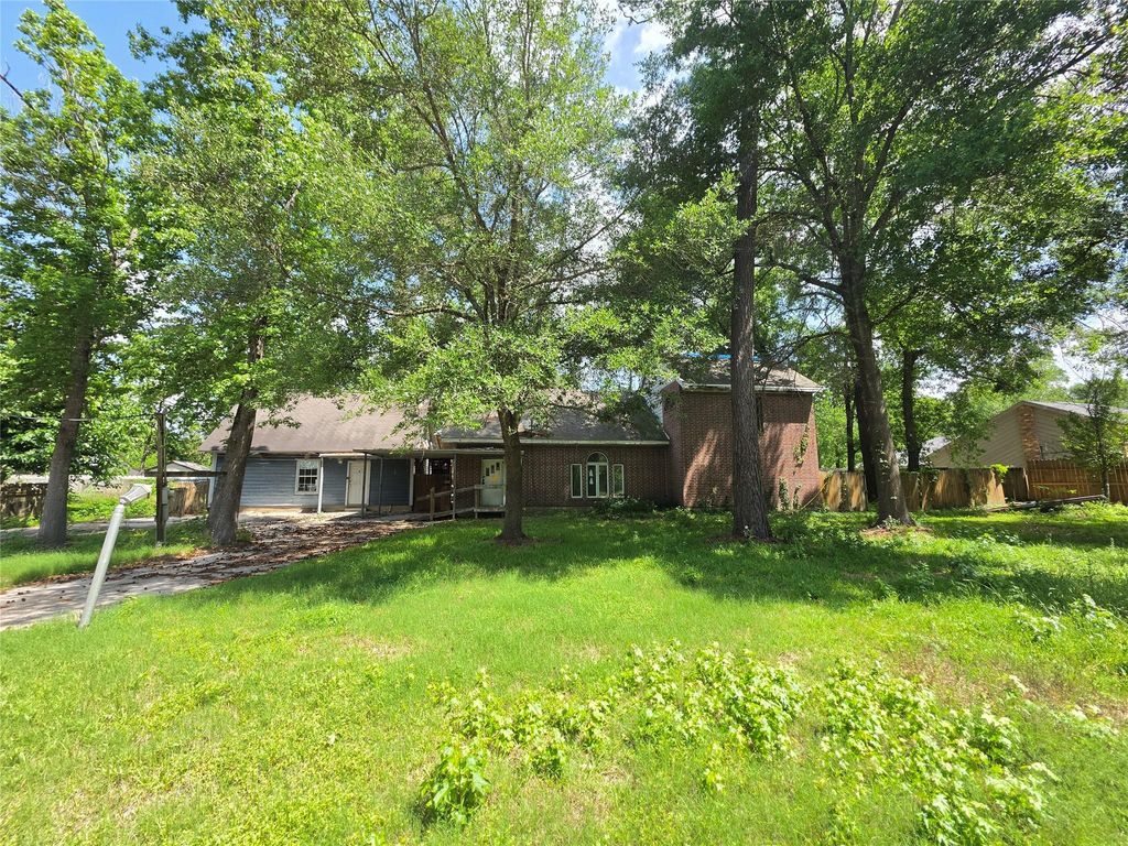 Photo of 12222 Oak Hollow Lane, Pinehurst, TX 77362 (MLS # 82151007)