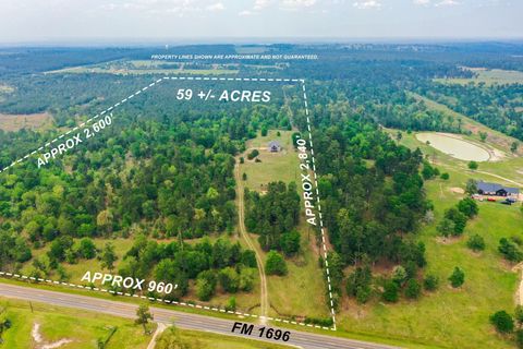Photo of 972 Fm 1696 Road W, Huntsville, TX 77320 (MLS # 76407720)