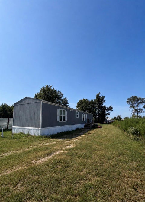 Photo of 1221 Road 5500, Cleveland, TX 77327 (MLS # 37409754)