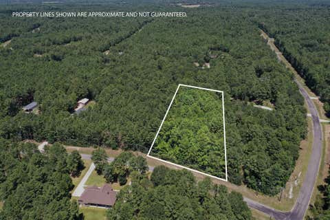 Photo of 3 Saddle Ridge, Huntsville, TX 77340 (MLS # 60925650)