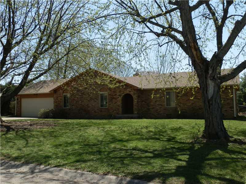Exterior Front. All brick ranch with a large backyard and mature trees.