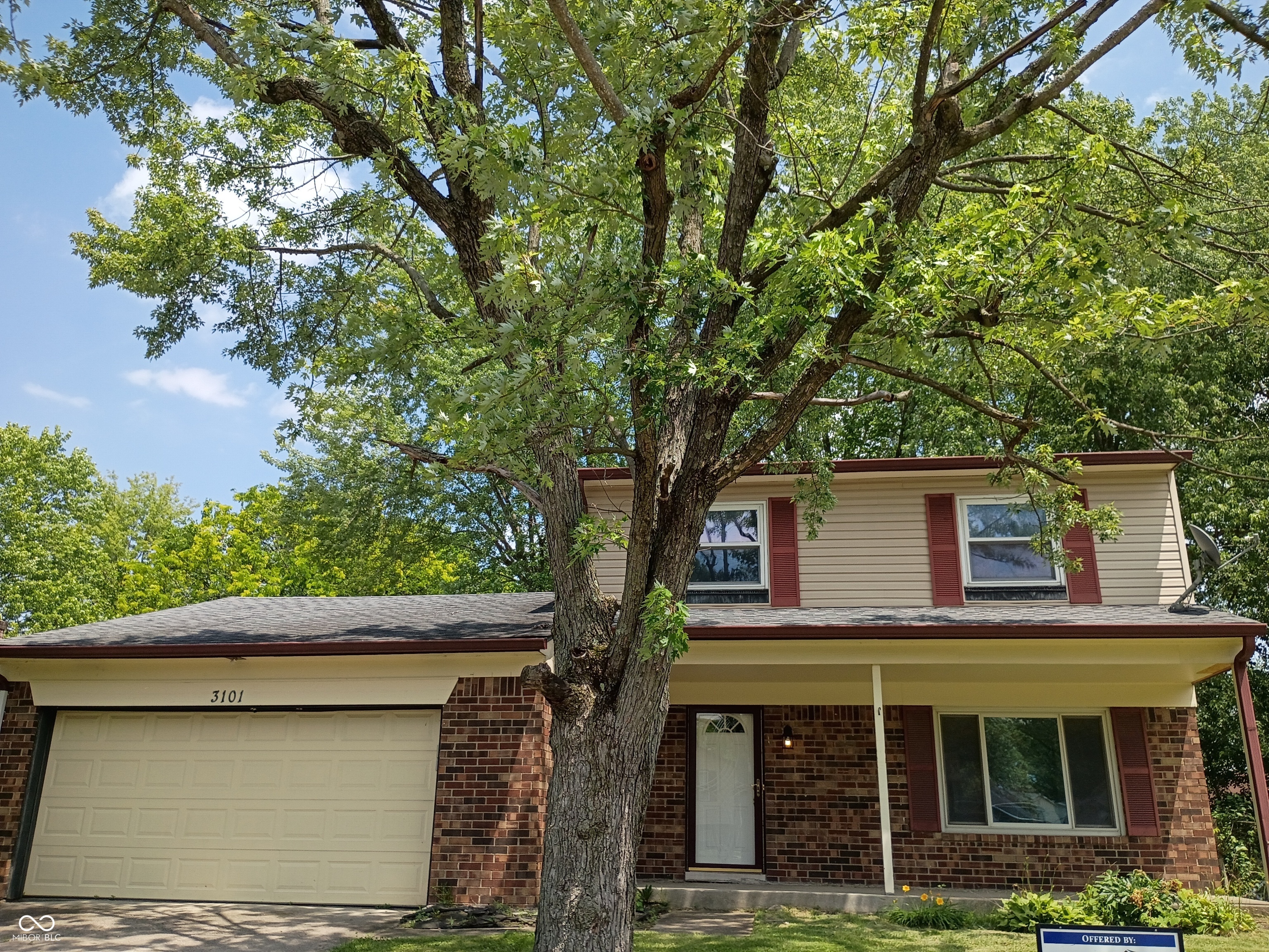 Two-story exterior front, brick first level