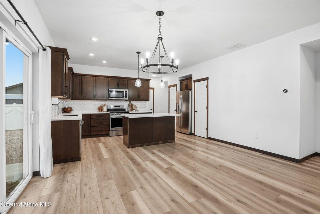 Photo of 8323 Splitrail Ave, Rathdrum, ID 83858 (MLS # 26-698)