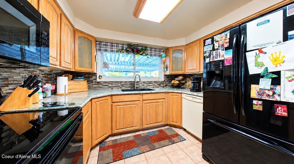 Photo of 2313 HONEYSUCKLE DR, Coeur dAlene, ID 83814 (MLS # 26-10176)