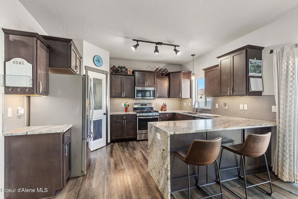 Photo of 12365 Renshaw Ave, Post Falls, ID 83854 (MLS # 26-3325)