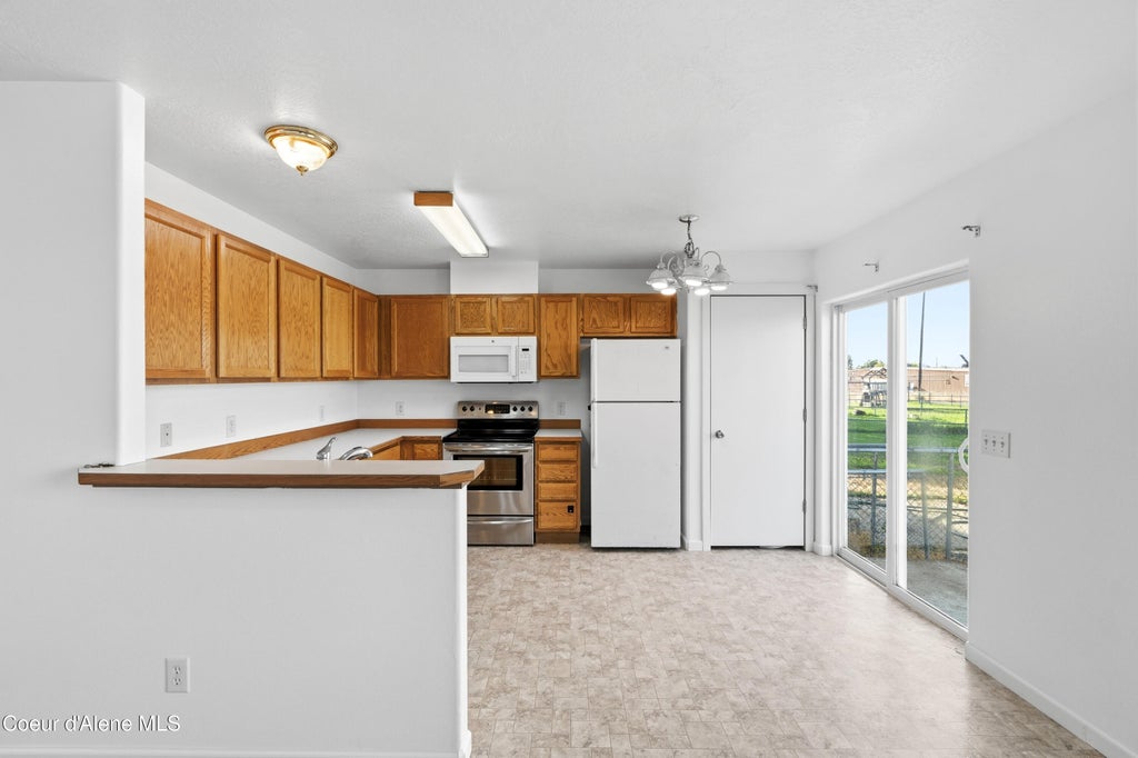 Photo of 1613 COEUR D ALENE Ave, Post Falls, ID 83854 (MLS # 26-9316)