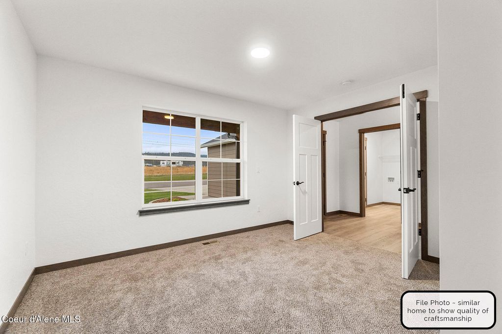 Photo of 9042 Swather Ave, Rathdrum, ID 83858 (MLS # 25-10953)