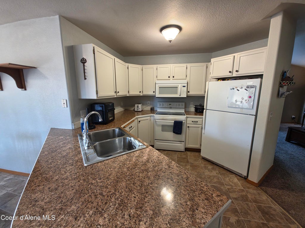 Photo of 106 Riverwood Ct, Post Falls, ID 83854 (MLS # 26-7749)