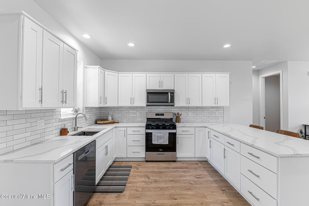 Photo of 203 Palamino, Pinehurst, ID 83850 (MLS # 26-7925)