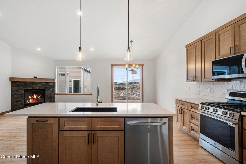 Photo of 8892 Swather Ave, Rathdrum, ID 83858 (MLS # 26-1570)