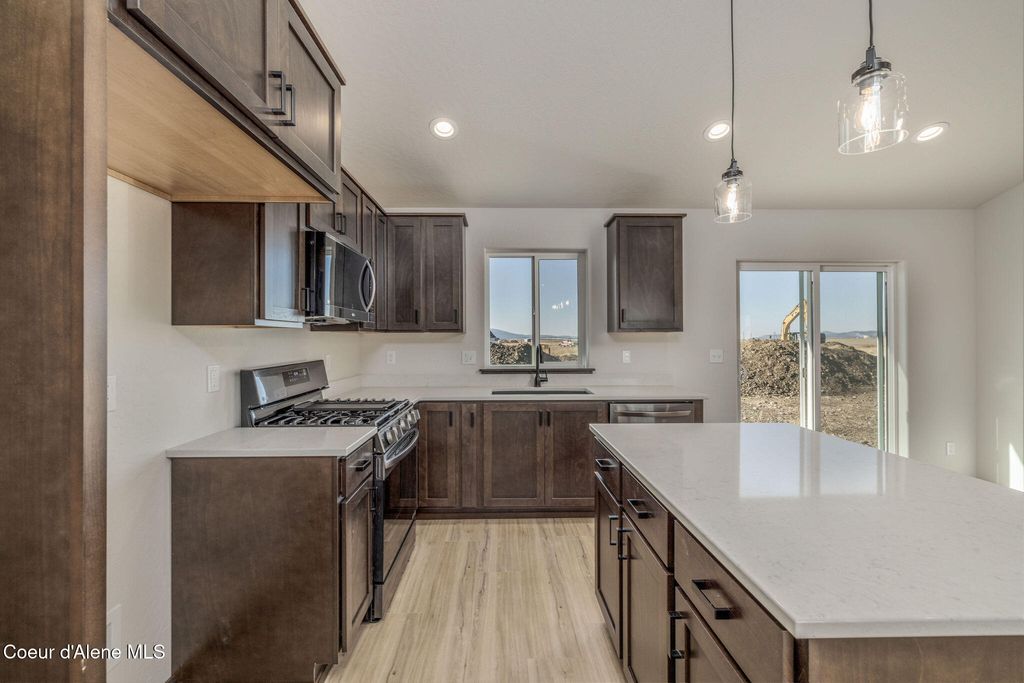Photo of 11723 SIMMONS LN, Rathdrum, ID 83858 (MLS # 26-4551)