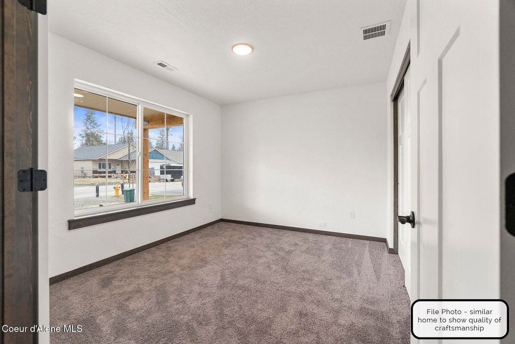 Photo of 9084 Swather Ave, Rathdrum, ID 83858 (MLS # 25-7272)