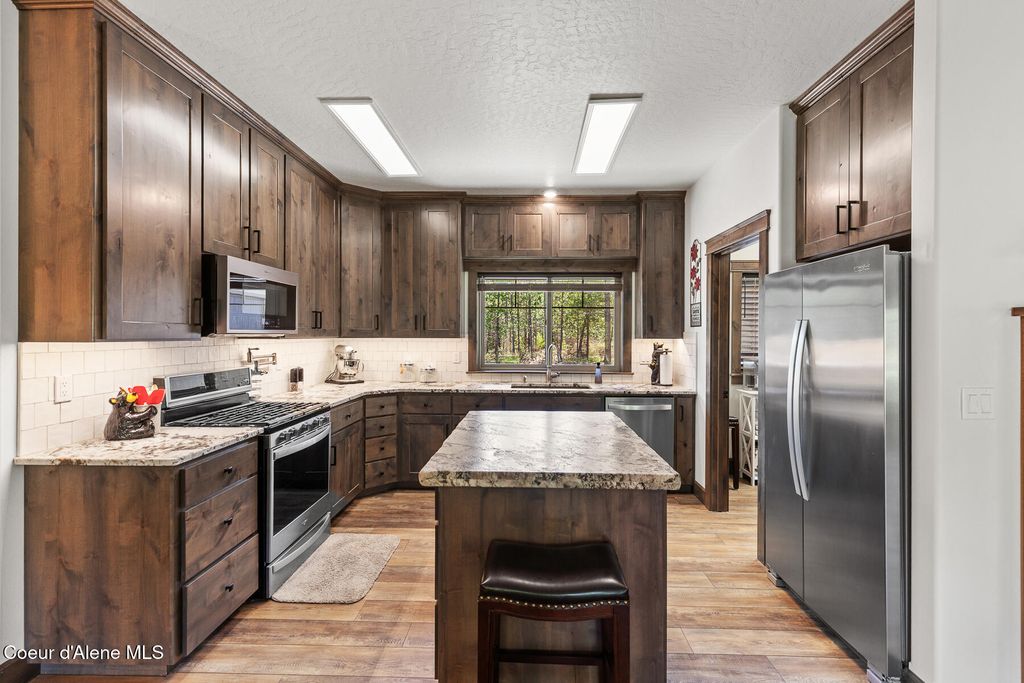 Photo of 545 Peacock Ln, Spirit Lake, ID 83869 (MLS # 26-3212)