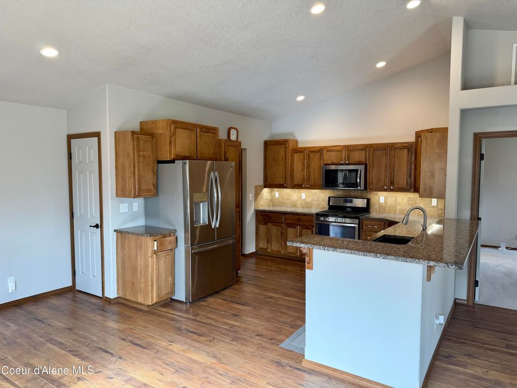 Photo of 843 Woodlawn Dr, Hayden, ID 83835 (MLS # 26-2027)