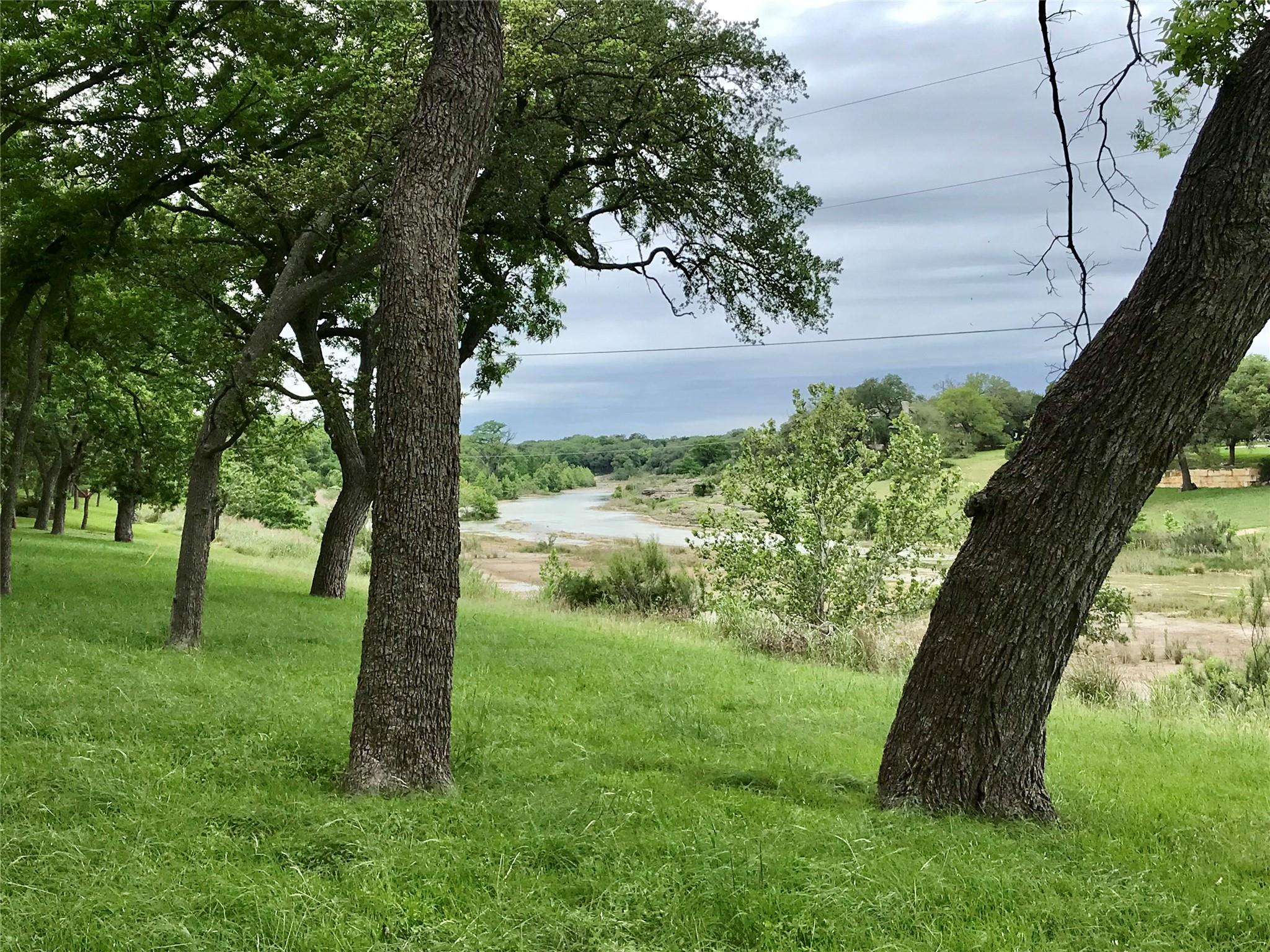 View of yard with a water view