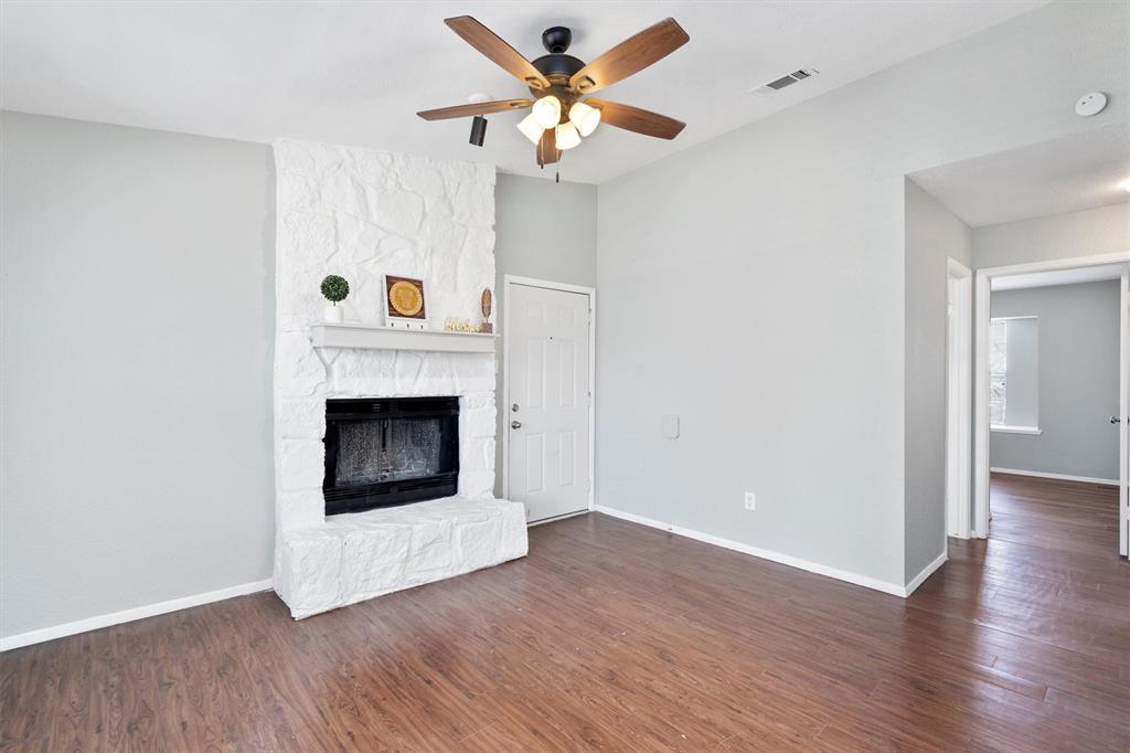 Unfurnished living room featuring dark wood finis