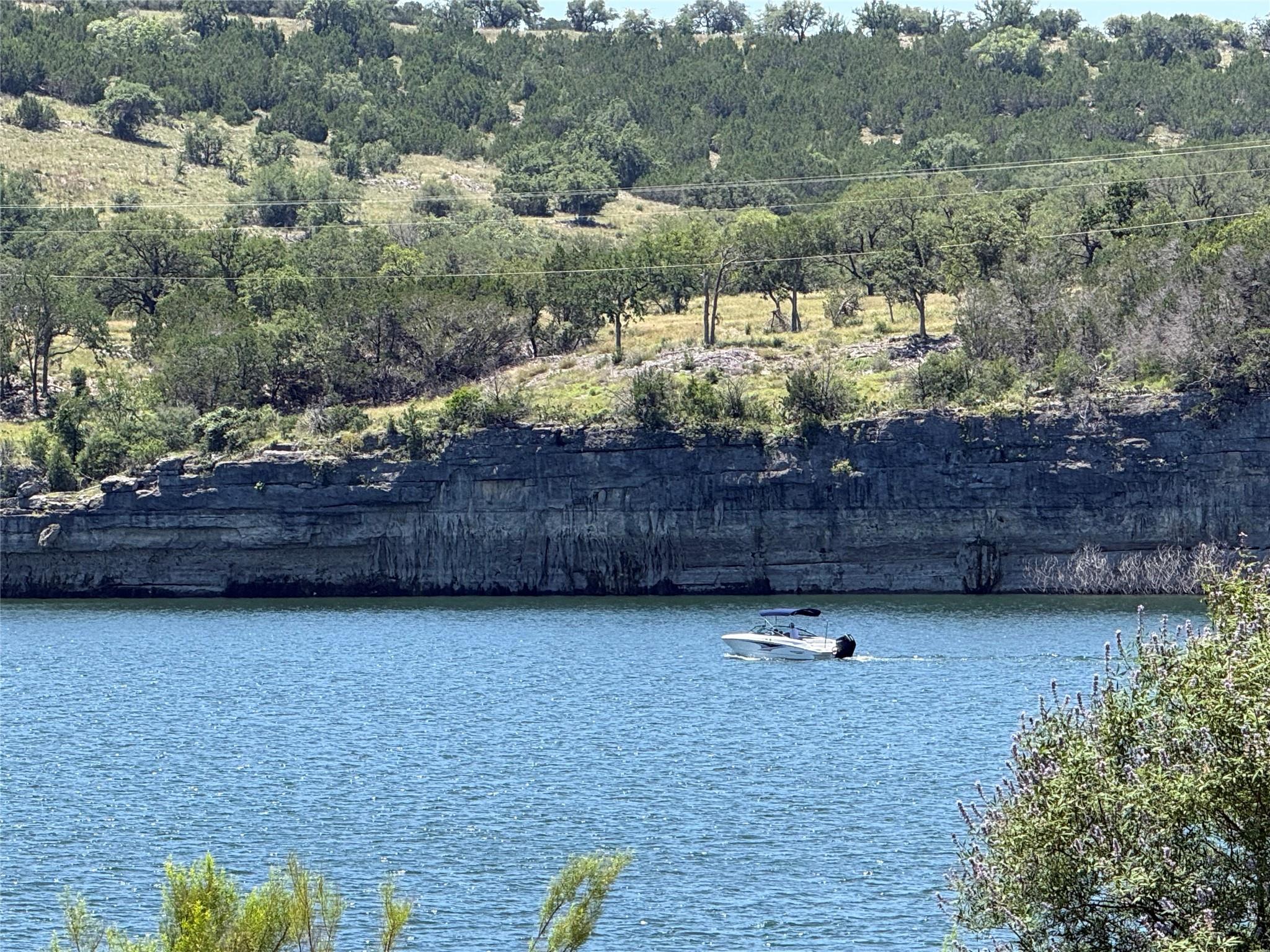 Waterfront lot featuring a natural shoreline and