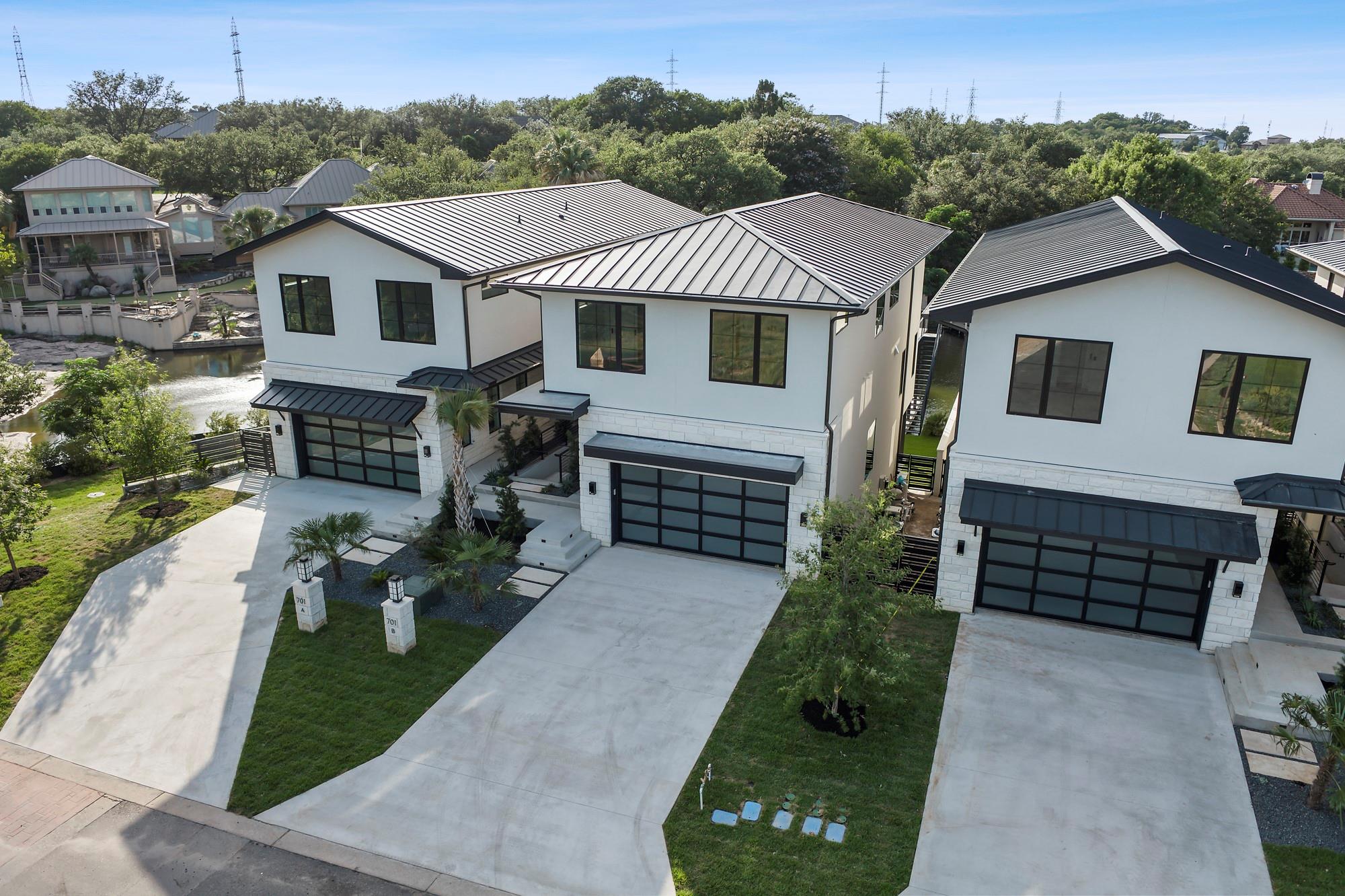 Modern farmhouse featuring a standing seam roof,
