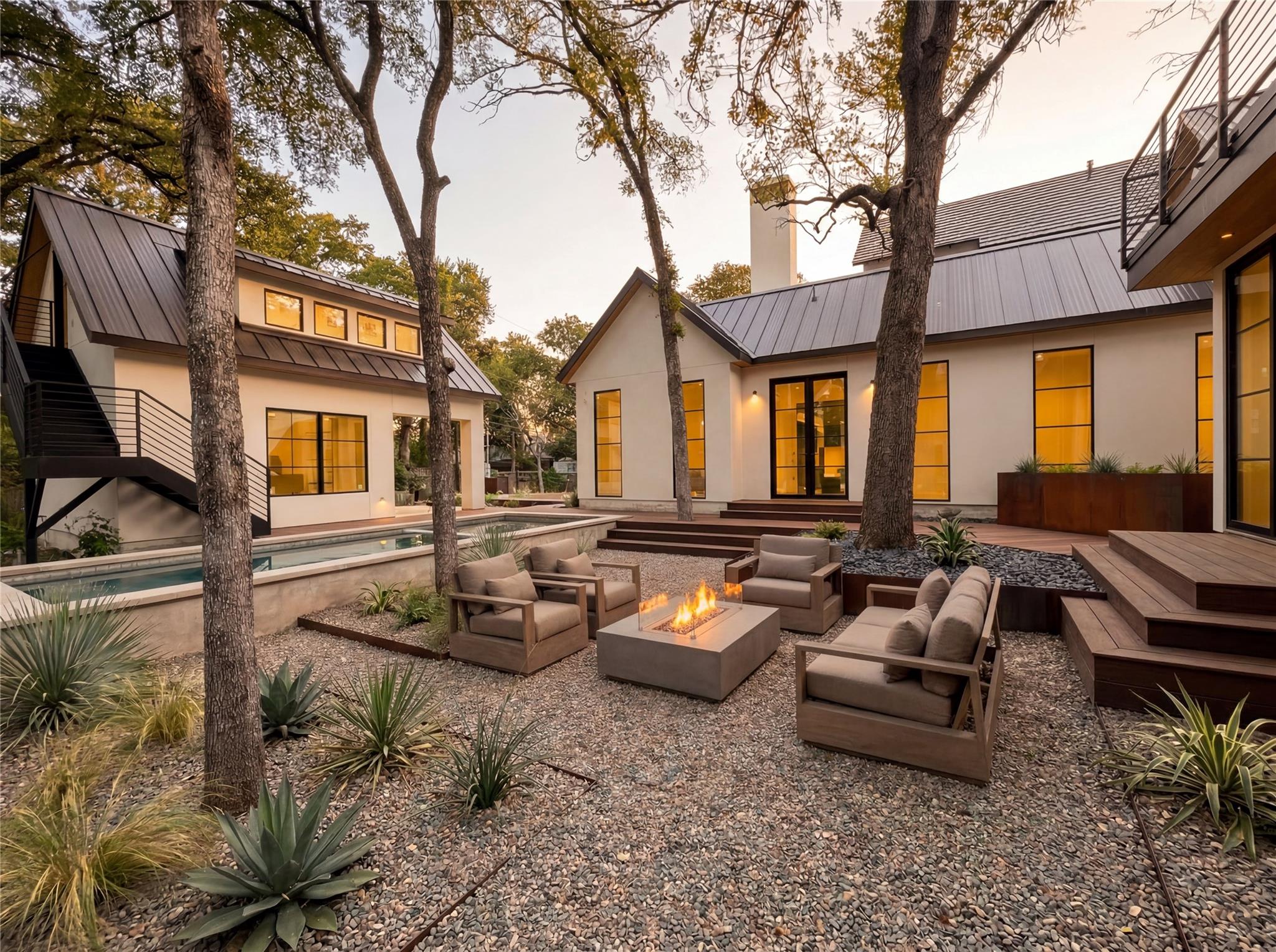 View of front of property with a front yard, stuc