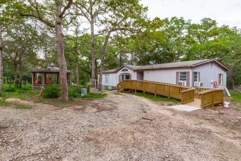 Photo of 319 Green Oaks DR, Bastrop, TX 78602 (MLS # 5518059)