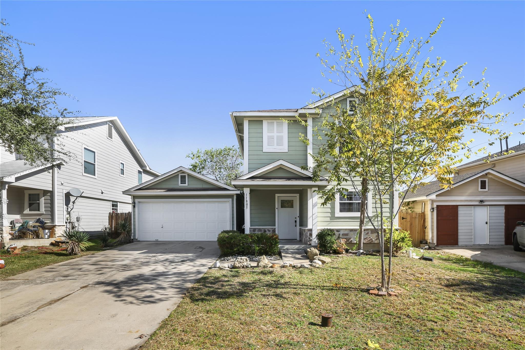 View of front facade with a front yard, a porch,