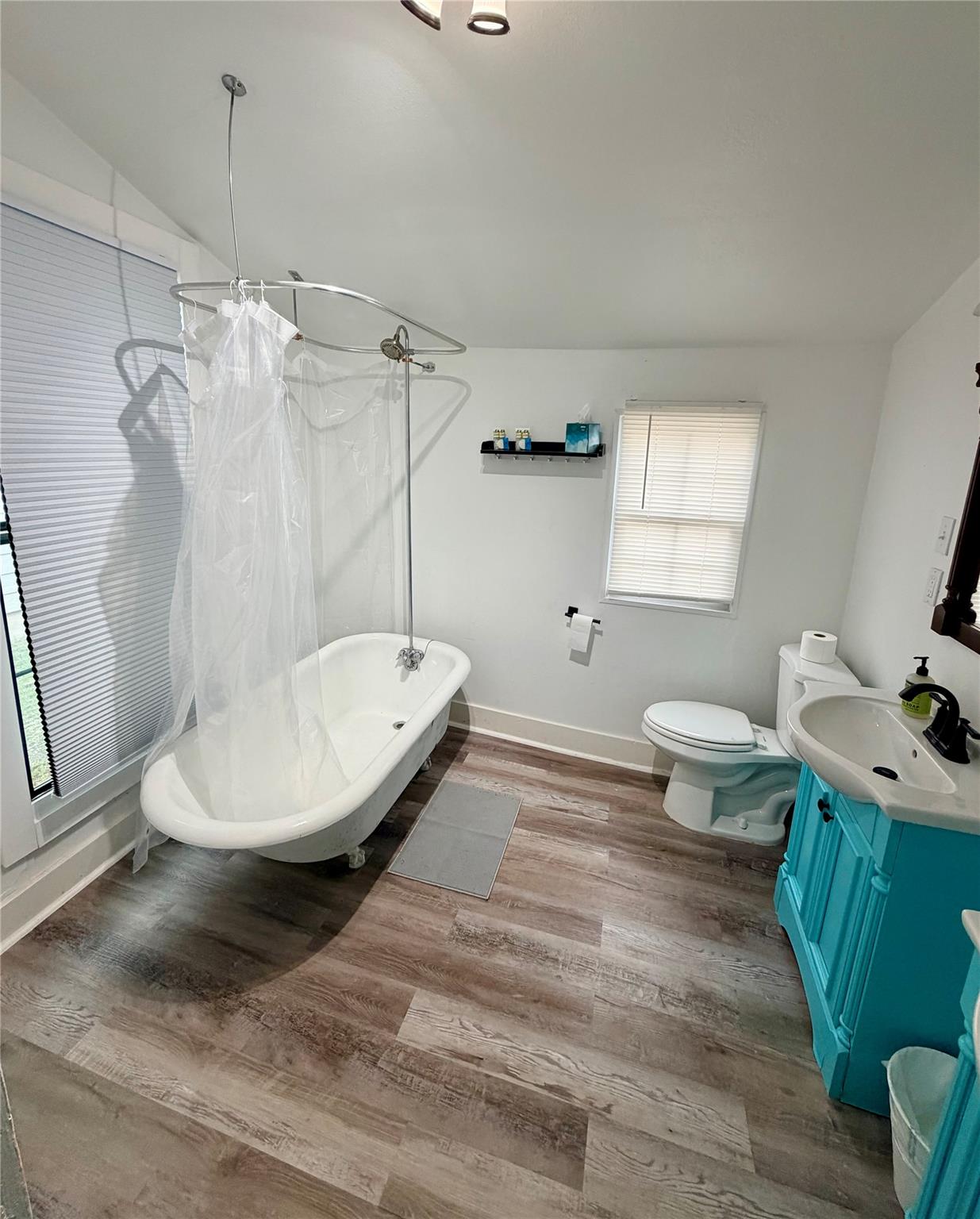 Bathroom featuring a clawfoot bathtub with an ove