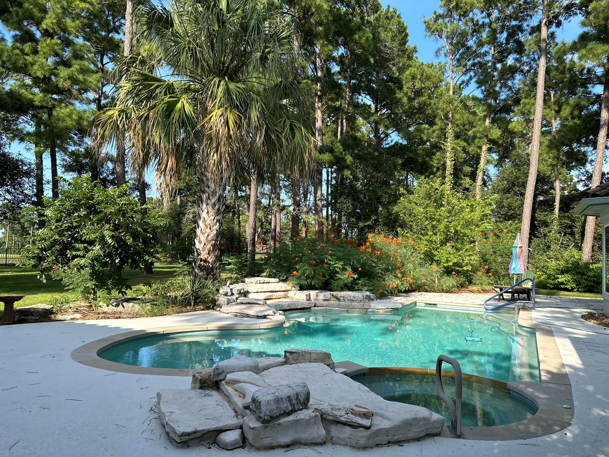 View of swimming pool featuring a pool with conne
