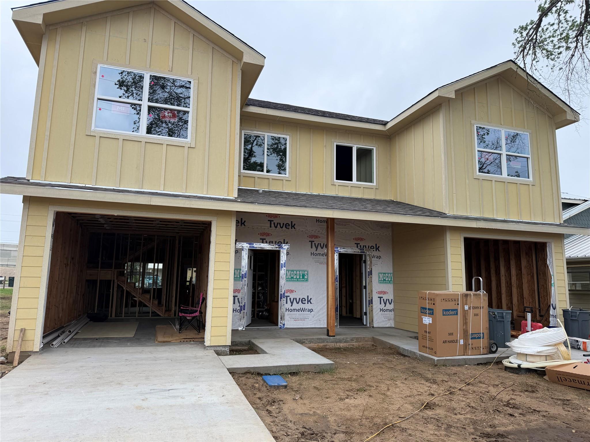 The property features a two-story design with yel