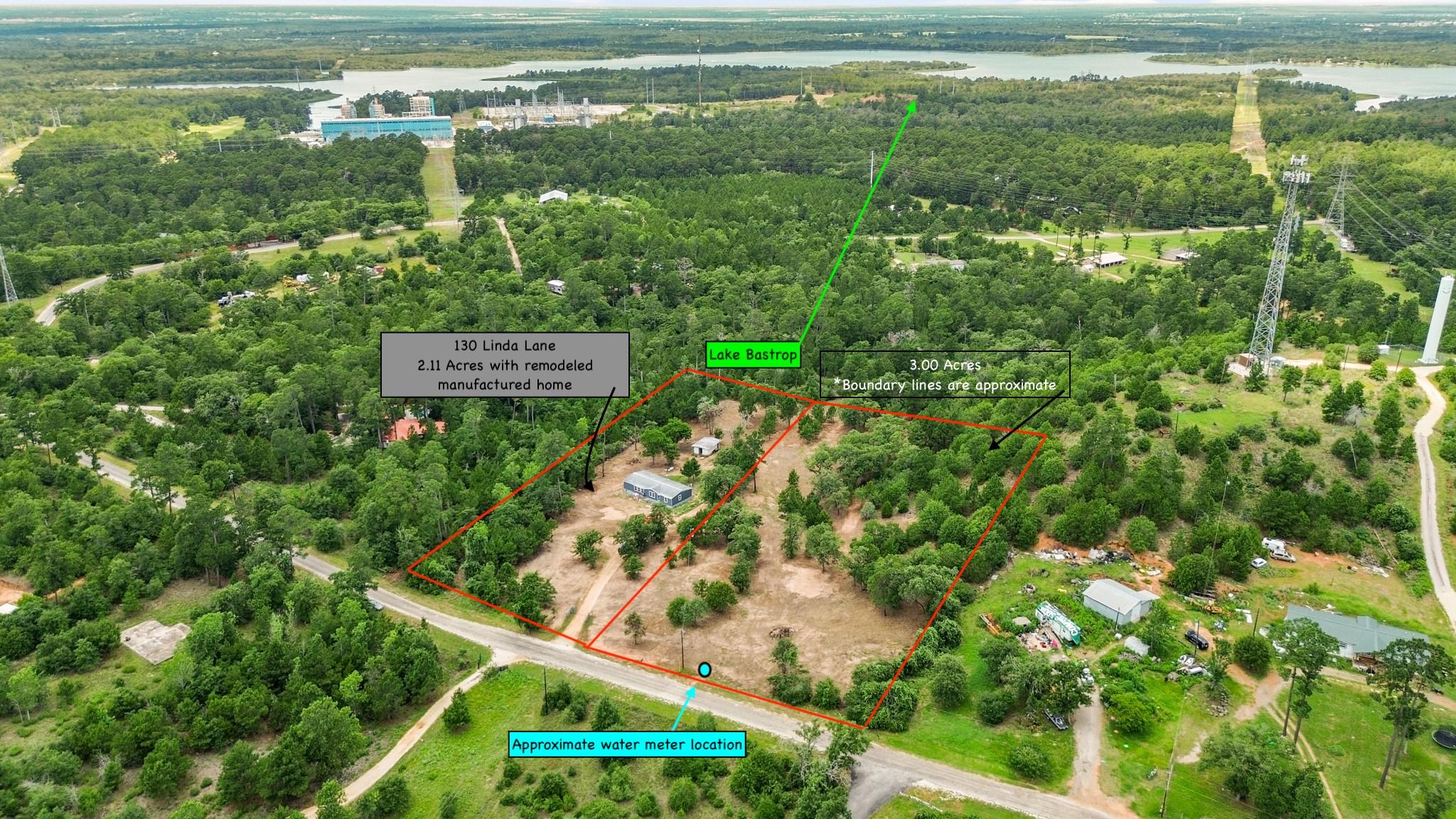 View of property location with a nearby body of w