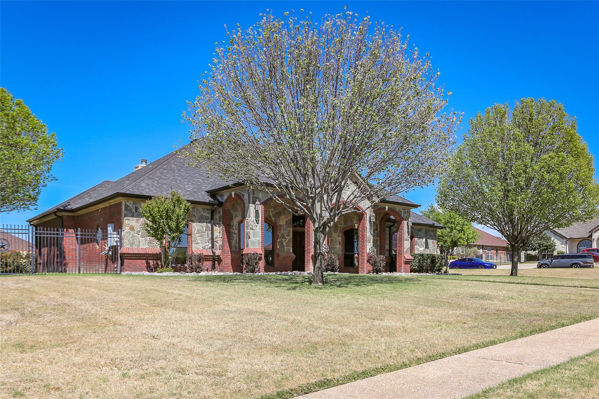 View of front facade featuring brick siding and s