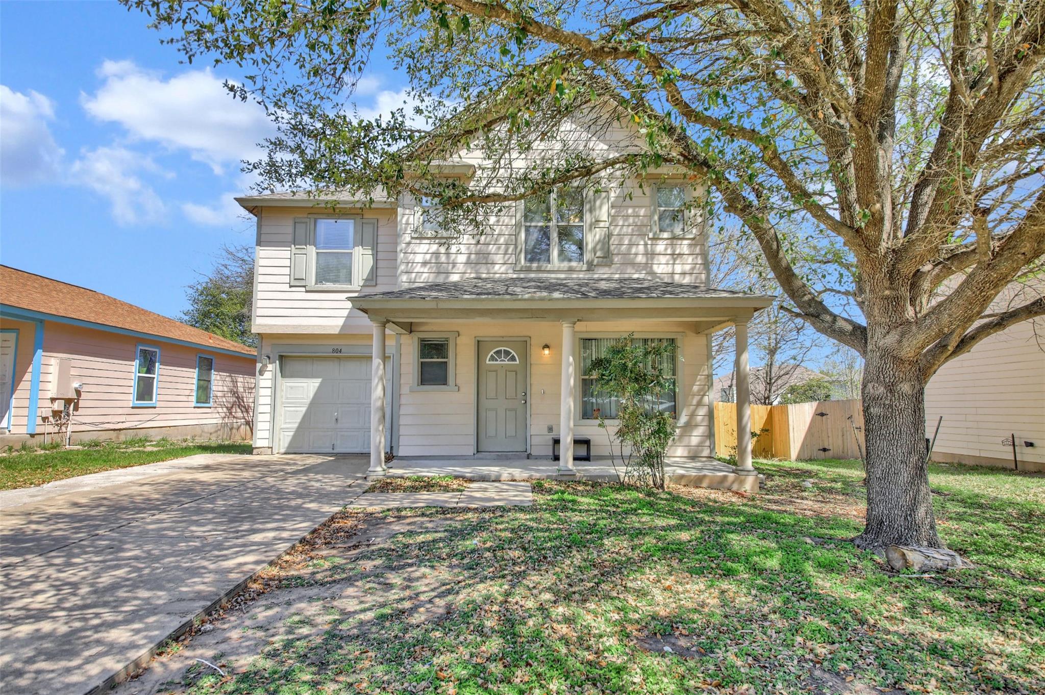 View of front of property featuring a porch, conc