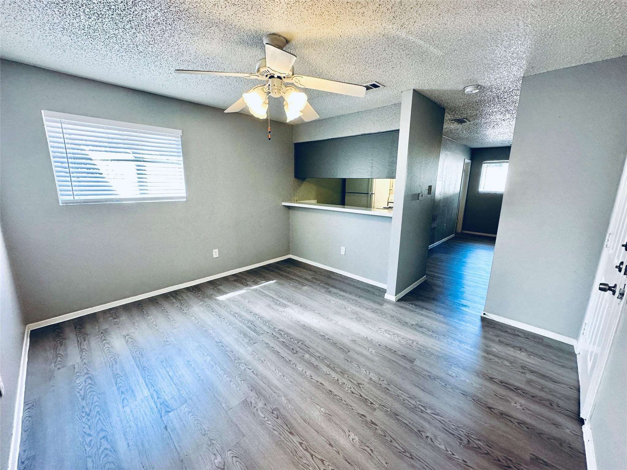Unfurnished room featuring light wood finished fl