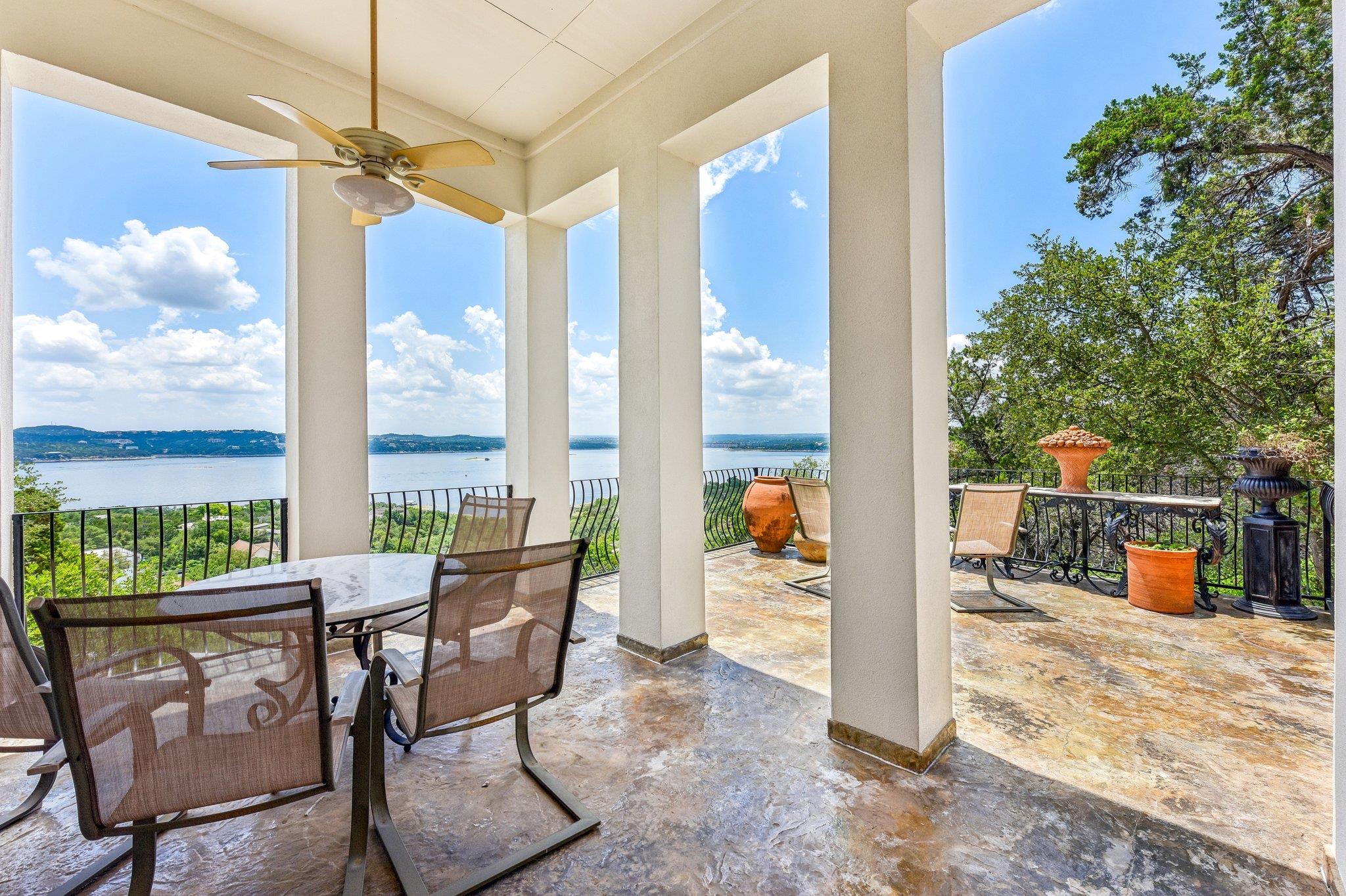 Custom Mediterranean-inspired estate in Comanche Trail, Austin TX 78732 ? white stucco architecture with a hilltop position delivering sweeping panoramic Lake Travis views."