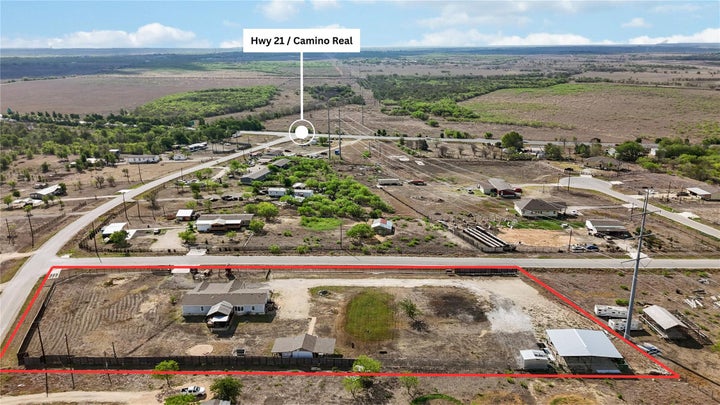 Aerial view highlighting this corner lot just off Highway 21, showcasing the full 2.20 acres, dual lots, and easy access…