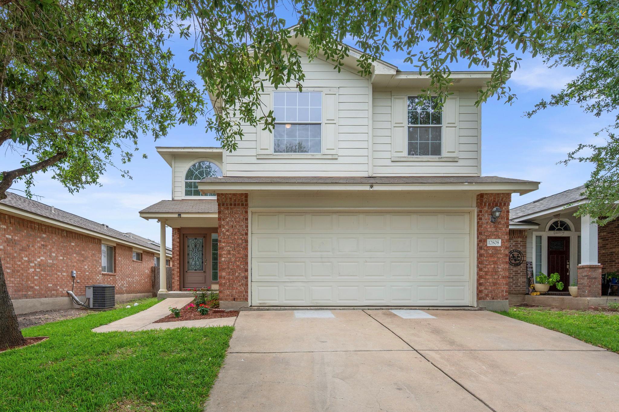 Two-story residence featuring a combination of br
