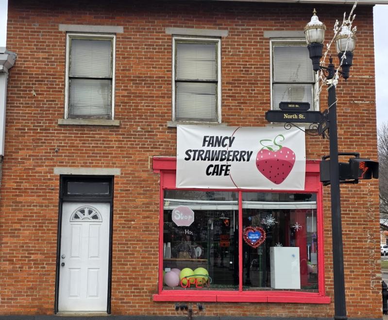 Fancy Strawberry Cafe with door leading to storage
