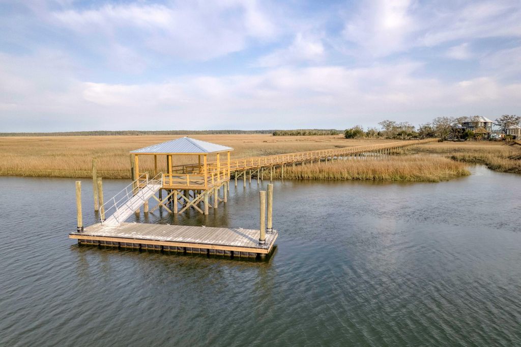 Photo of 925 Fish Camp Road, Charleston, SC 29492 (MLS # 26004000)