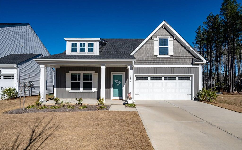 Photo of 1033 Marsh Harrier Dr, Ravenel, SC 29470 (MLS # 26002414)