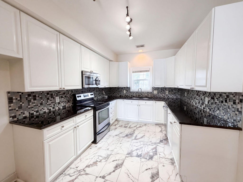 Photo of 4933 Lake Palmetto Lane, North Charleston, SC 29418 (MLS # 26026941)